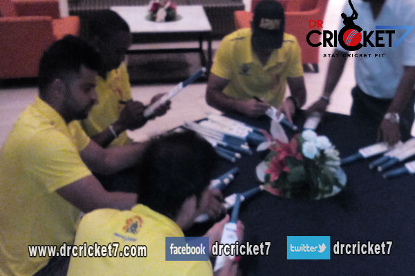 MS Dhoni and rest of CSK players signing autographs.