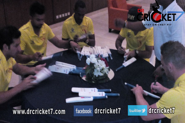 MS Dhoni and rest of CSK players signing autographs.