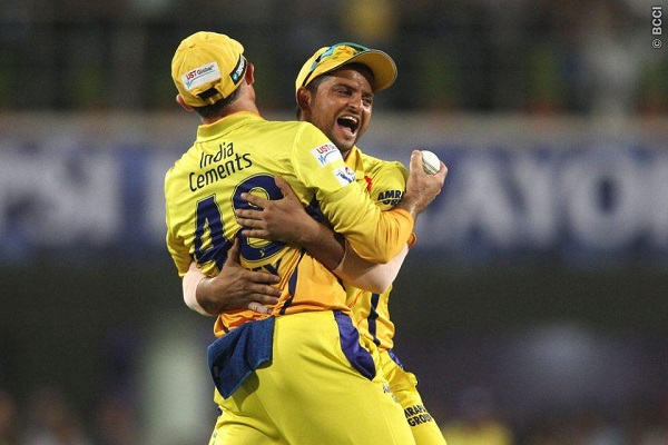 Michael Hussey is congratulated by Suresh Raina for taking the catch to get Mandeep Singh.