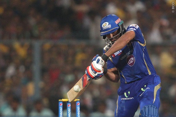 Mumbai Indians captain Rohit Sharma square drives a delivery to the boundary.