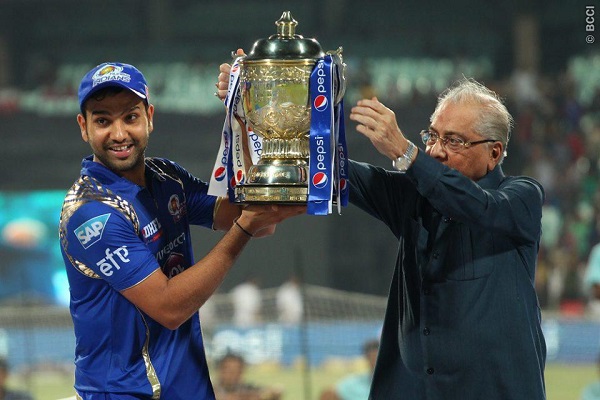 Rohit Sharma captain of the Mumbai Indians receives there winners trophy.