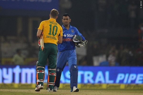 MS Dhoni, captain, of India of India shakes hands with David Miller of South Africa.