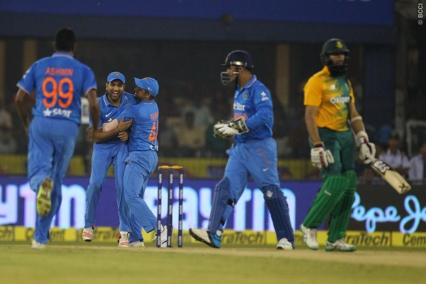 Rohit Sharma of India celebrates the wicket of Hashim Amla of South Africa.