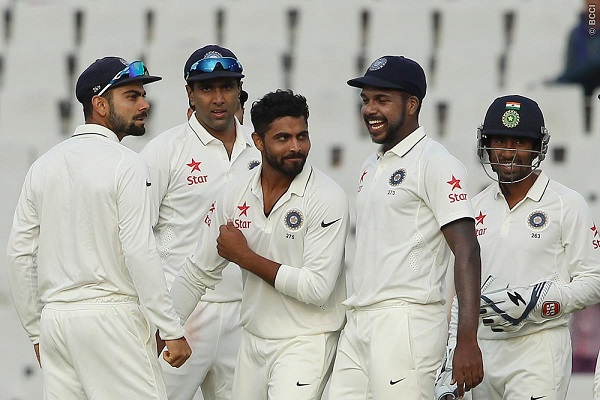 Ravindra Jadeja of India celebrates the wicket of Dean Elgar of South Africa during the Mohali Test.